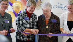 Tracy Buckler and Sister Margaret Smith cutting the ribbon