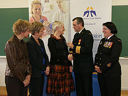 Colonel Jean Grondin presents Dr. Patricia LePage with the Canadian Forces General Service Medal for her work in Kandahar, Afghanistan