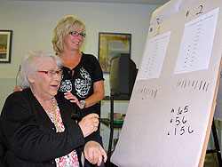 Mildred Maurer, left, adds up the score of a game with registered nurse, Donna Popowich, in the Seniors' Psychiatry Day Program run at St. Joseph's Care Group - Lakehead Psychiatric Hospital