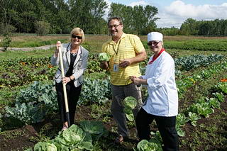 <strong>Green Werks Garden at St. Joseph's Care Group is celebrating another successful harvest. The Green Werks Garden produces organically-grown vegetables and provides employment experience for consumers of mental health services. This year, the Care Group will start using seasonal produce from the garden in its cafeteria and catering menus.</strong><br /> From left to right: <strong>Tracy Buckler</strong>, CEO & President, <strong>Doug Dowhos</strong>, Supervisor Employment Development, <strong>Julie Nix</strong>, Sodexo Chef for St. Joseph's Care Group.