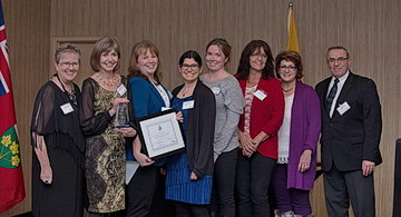 <strong>Exceptional Approach to Engagement Accolades for SJCG's Regional Palliative Care Program</strong> (from left to right): <strong>Laura Kokocinski</strong>, CEO, North West LHIN; <strong>Kathleen Lynch</strong>, Vice President, Rehabilitative Care & Chronic Disease Management, SJCG; <strong>Jill Marcella</strong>, Coordinator, North West LHIN Regional Palliative Care Program, SJCG; <strong>Hilary Mettam</strong>, Community Development Lead, North West LHIN Regional Palliative Care Program, SJCG; <strong>Rebecca McEwan</strong>, Clinical Co-Lead, North West LHIN Regional Palliative Care Program, SJCG; <strong>Cindy Harvey</strong>, Administrative Assistant, North West LHIN Regional Palliative Care Program, SJCG; <strong>Marlene Benvenuto</strong>, Telemedicine Palliative Registered Nurse Consultant, Regional Palliative Care Program, SJCG; <strong>Gil Labine</strong>, Board Chair, North West LHIN; <strong>Dr. Kathy Simpson (Missing from Photo)</strong>, Clinical Co-Lead, North West LHIN Regional Palliative Care Program, SJCG;